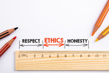 Ethics, Respect and Honesty concept. Wooden liner with colored pencils on a white background