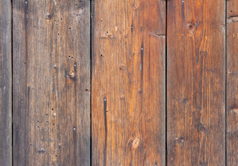 wooden background, old village fence with slits and nails.