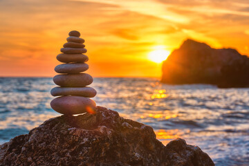 Concept of balance and harmony - stone stack on the beach