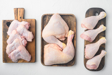 Fresh chicken meat cuts Farm poultry meat, on wooden cutting board, on white background, top view...