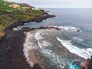 Rocky, volcanic beach and unsettled atlantic ocean. La Palma Island. Aerial view.