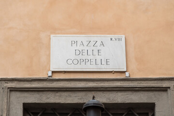 Street sign in the historical center in Rome, Italy, with the text: "Piazza delle Coppelle"