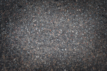 Asphalt road texture, top view. Dark grey abstract background.