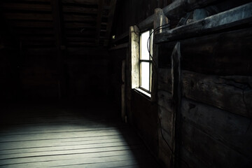 Horror background causing fear. Scary mystical mysterious dark attic room in an abandoned wooden...