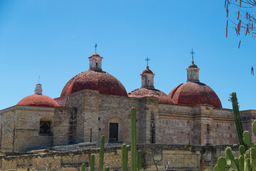 Catholic cathedral next to the ruins of the ancient city of Mitla, Oaxaca, Ruinas Zapotecas. Mexico Zapoteco Ruins - obrazy, fototapety, plakaty