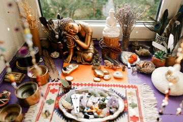 Buddha's home altar with stones and offerings - obrazy, fototapety, plakaty
