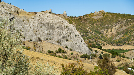 Fototapeta na wymiar Mountain Two brothers above Veseloe village near Sudak. Crimea mountain landscape on sunny autumn day.