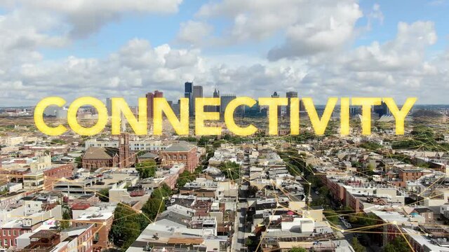 CONNECTIVITY word art appears on aerial of urban city in USA. Grid overlay symbolizes communications and technology.