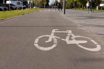 Obraz premium Bicycle Lanes in Park. White sign bike path.