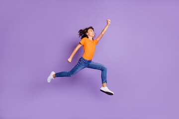 Fototapeta na wymiar Full length body size view of attractive successful cheerful boy jumping striving isolated over violet purple color background