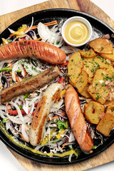 mixed german traditional organic sausage and potato meal platter