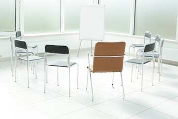 Plastic flipchart chairs in a bright office space
