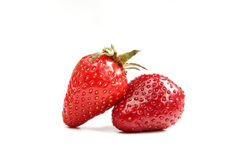 Two shiny strawberries isolated on white background
