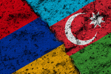 Concept of the Conflict between Armenia and Azerbaijan with painted Flags on a Wall and a Crack between them