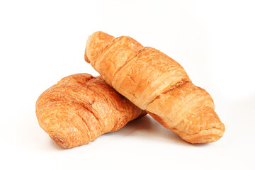 Two croissants isolated on white background. Golden color