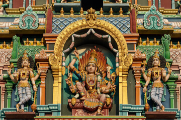 Fototapeta na wymiar Colourful statues of Hindu religious deities adorning the interior of a Hindu temple in Singapore.