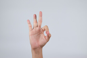 The hand that gestures is an OK sign and is separated from the background. (Clipping Path)