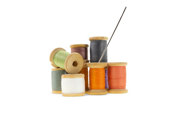 Wooden bobbins for gray, orange, burgundy, purple threads on white isolated background. Handmade, needlework, sewing items. Copy space