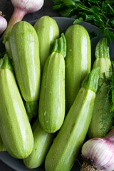 Fresh spring vegetables - zucchini, fresh garlic, wild fennel and parsley

