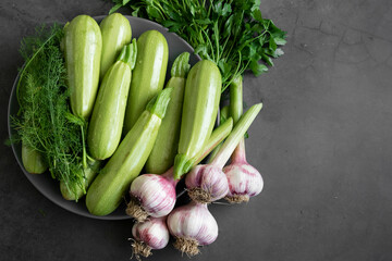 Fresh spring vegetables - zucchini, fresh garlic, wild fennel and parsley
