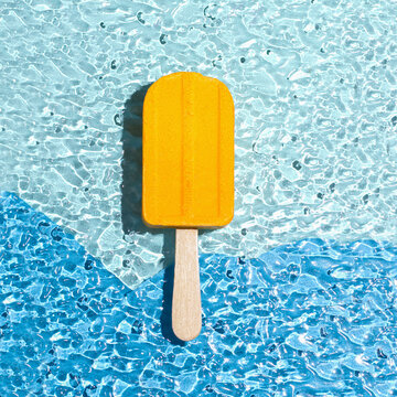 A bath bomb in the shape of an ice cream yellow. Summer concept