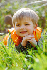 portrait of a fashionable little boy in nature