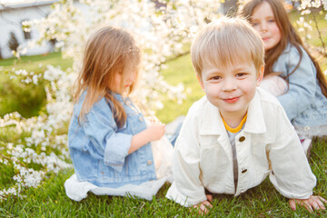 portrait of three children in the spring in nature