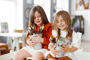 portrait of two girls sisters in studio