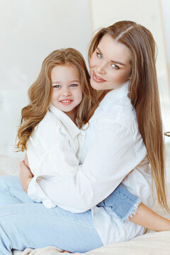 Portrait Of Mom And Daughter In The Studio