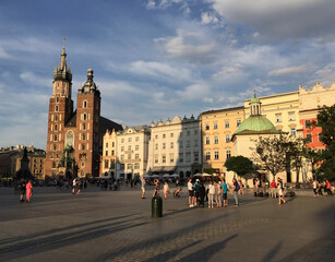 Fototapeta premium The St. Mary's Basilica, the Church of St. Adalbert and the Adam Mickiewicz Monument in Kraków's Main Square.