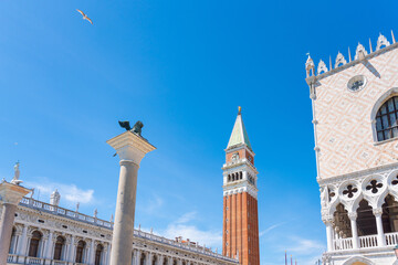 Fototapeta na wymiar St Mark Square, campanile and buildings, blue sky. Venice, Italy
