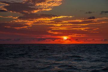 Bright colorful orange sunrise in the open sea