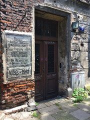 The entrance to an old residential building located in Bawół Square in Kraków, Poland, in the old Jewish quarter of Kazimierz. 