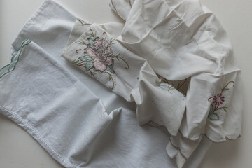 cotton fabric linens (pillow case and doily) - photographed from above with ambient light