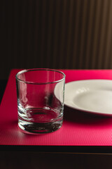 Empty glass and plate waiting to be served