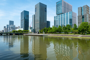 Obraz premium Bridge and financial center office building in Ningbo East New Town, China