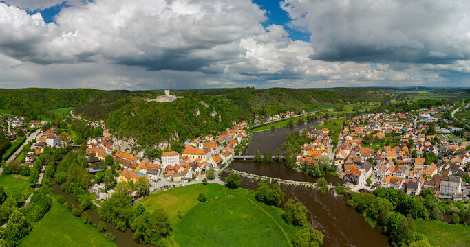 Aerial panoramic view of Kallm&uuml;nz, Kallmuenz in Upper Palatinate, Bavaria with castle ruin and rivers Naab and Vils on sunny day with dramatic clouds