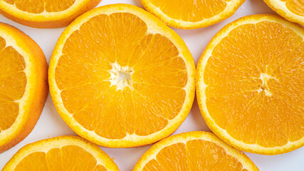 Large orange slices close up. Orange circles on a white background. Perfectly constructed fiber. Healthy life