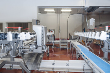 Industrial production cutting large quantities of meat.Automated line poultry equipment.Meat...