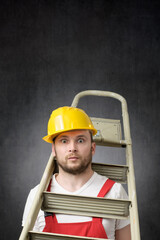 Portrait of a clumsy worker with ladder