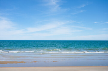 Fototapeta na wymiar Beautiful blue tropical sea on the beach and brightly sky