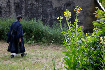 Zen buddhist monk walking in Orval, Belgium