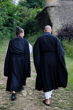 Zen Buddhist Monks Walking In Orval, Belgium