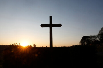 Cross at dusk at Le Bec Hellouin, Eure, France.