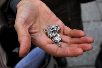 Street evangelizer's medals in Paris, France.