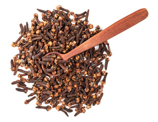 top view of spoon on pile of dried cloves on white