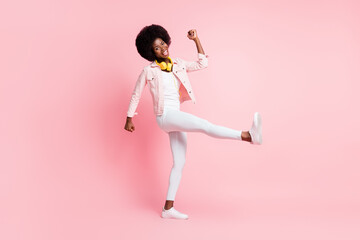 Full length body size view of skinny ecstatic cheerful girl listening melody hit dancing having fun rest isolated over pink color background