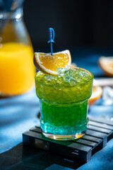 Refreshing cocktail with ice and orange slice. Lemonade. Summer colorfull drink. Bar concept. High quality photo