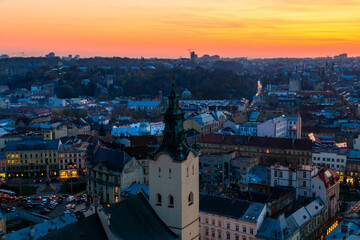 Obraz premium Aerial view of Latin cathedral and Rynok square in Lviv, Ukraine at sunset. View from Lviv town hall