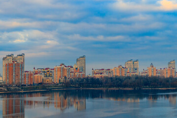 Fototapeta premium View of Obolon embankment of the Dnieper river and church of the Nativity of Christ in Kiev, Ukraine